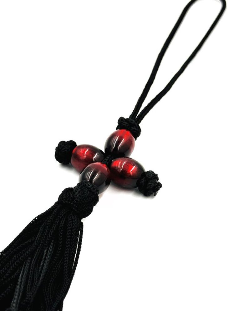 Car pendant with red beads